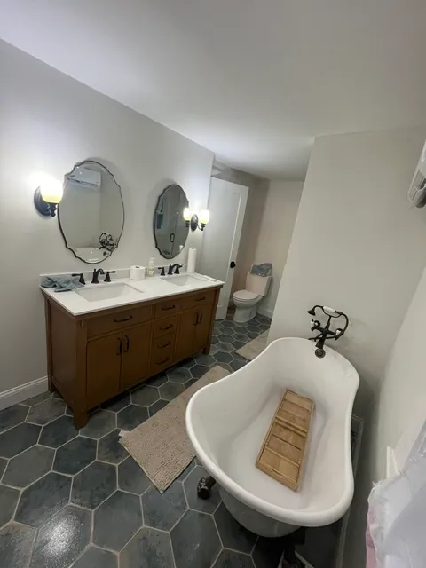 Bath & Laundry — Clawfoot tub on hex tile