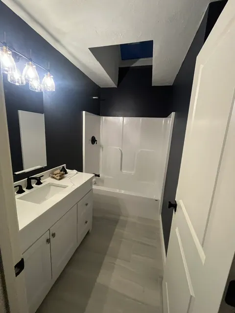 Guest Bathroom — Custom vanity and sconce lighting
