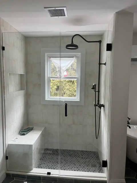 Walk-In Shower — Glass enclosure with tiled bench