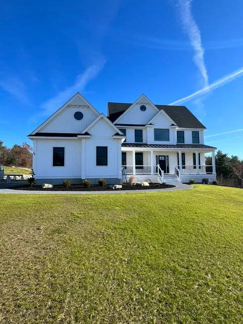 Completed modern farmhouse exterior by YK United Builders