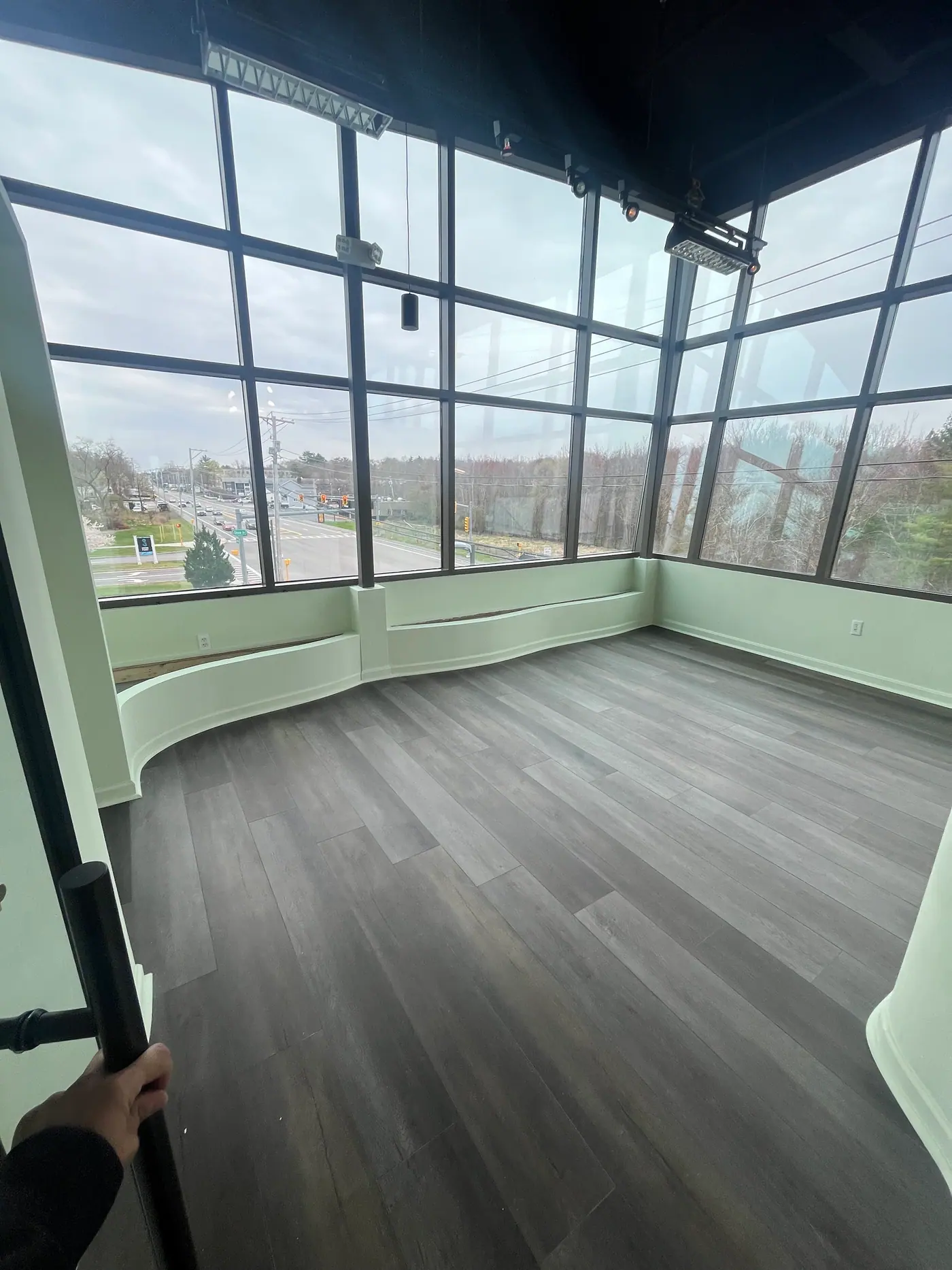 Window Wall Interior — Wide-plank flooring under full-height glazing