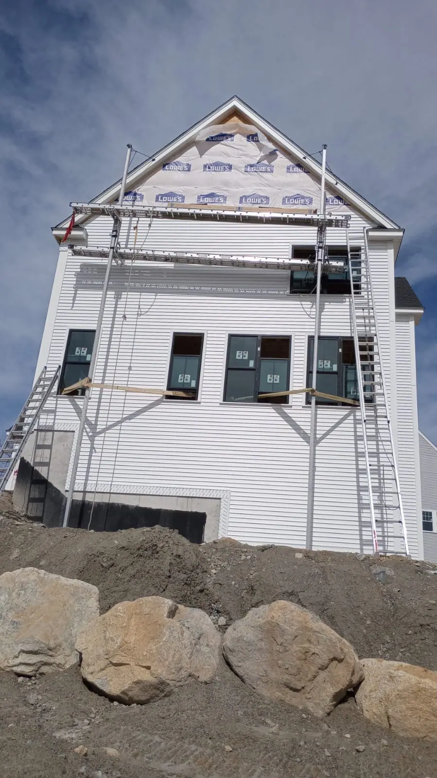 Exterior In Progress — Staging up for siding and trim